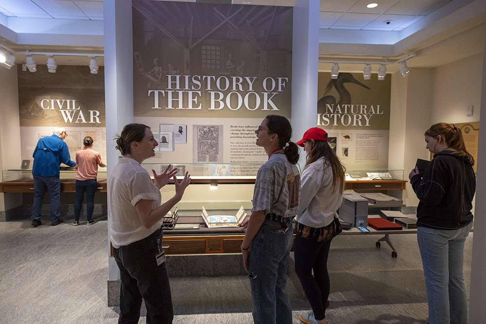 Students hear an introduction to the History of the Book exhibit