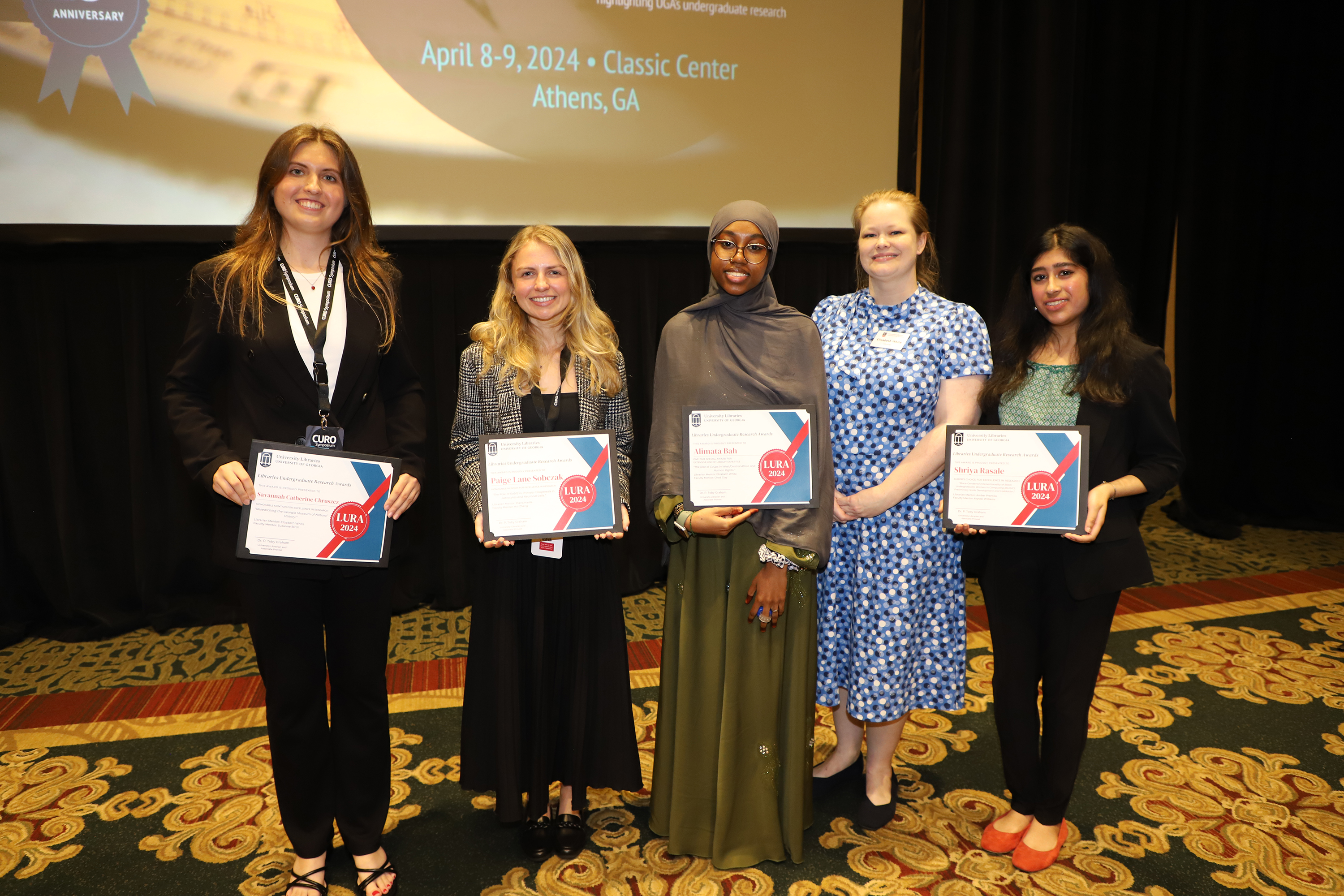 Winners of the Libraries Undergraduate Research Award. Pictured left to right are  Savannah Chruszcz, Paige Sobczak, Alimata Bah, Shriya Rasale   Hannah Bowen and Sara Logsdon not pictured.