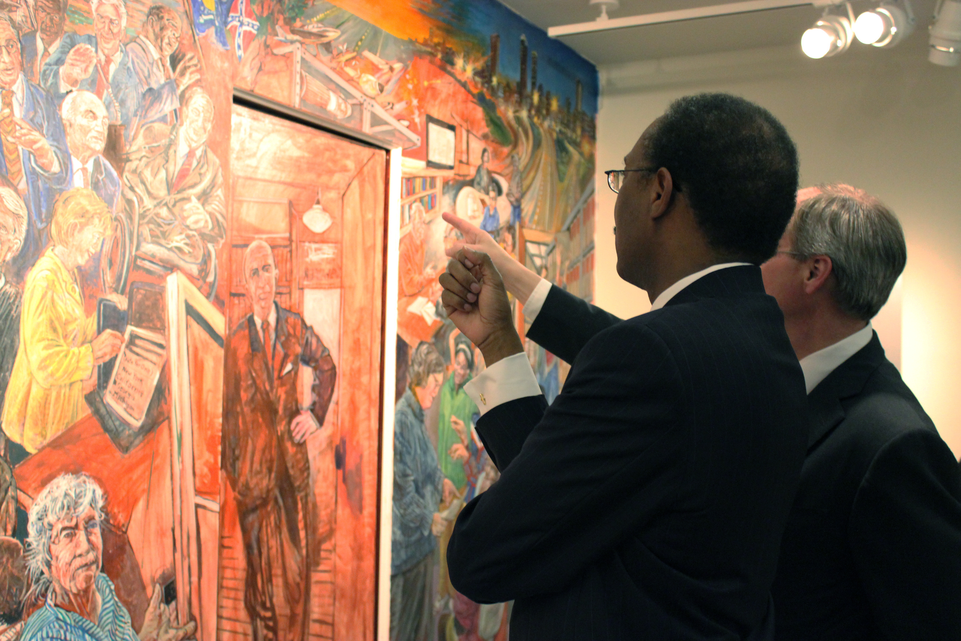 Russell Foundation trustees examine Art Rosenbaum's mural "Doors."