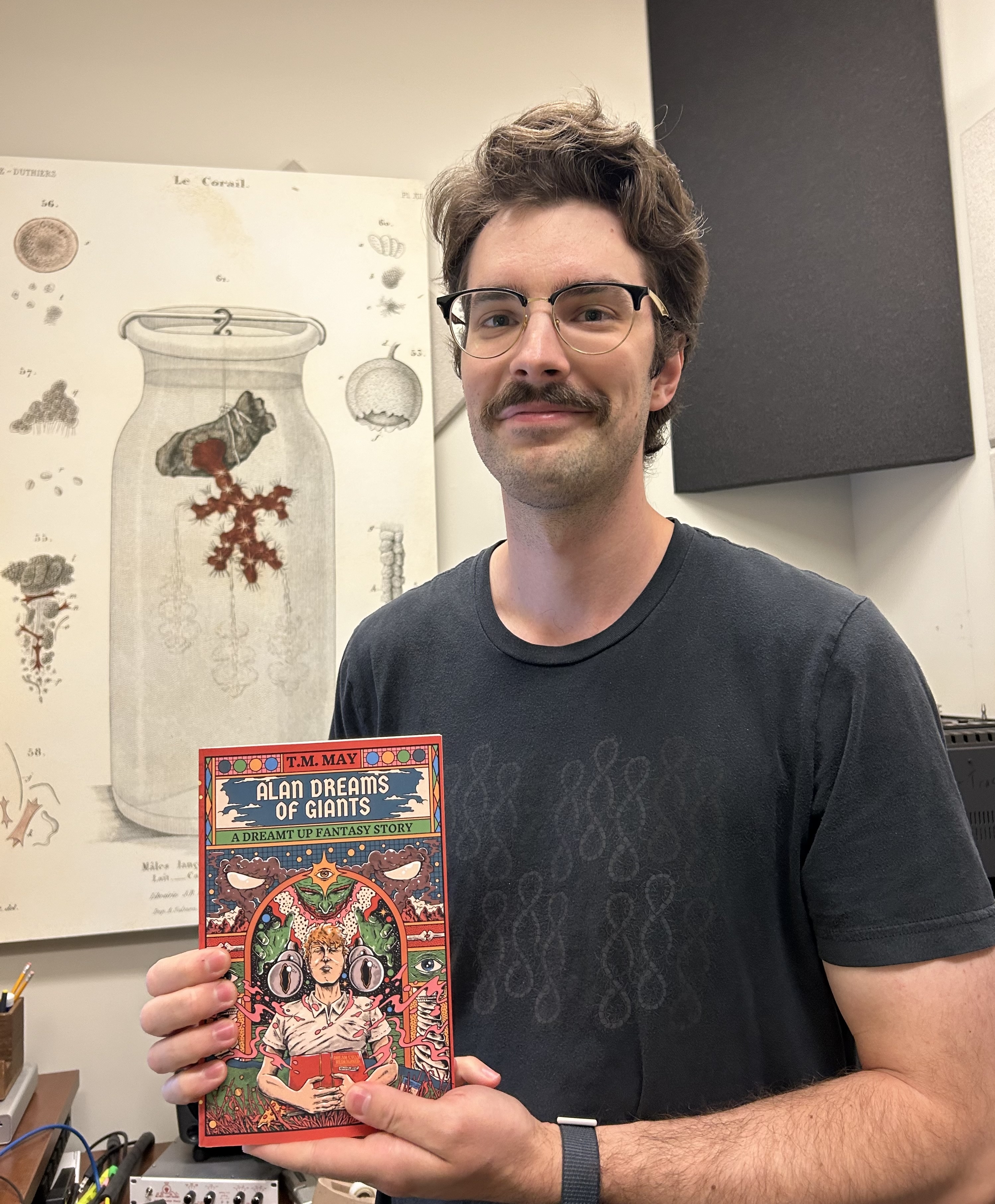 Thomas May holds book Alan Dreams of Giants