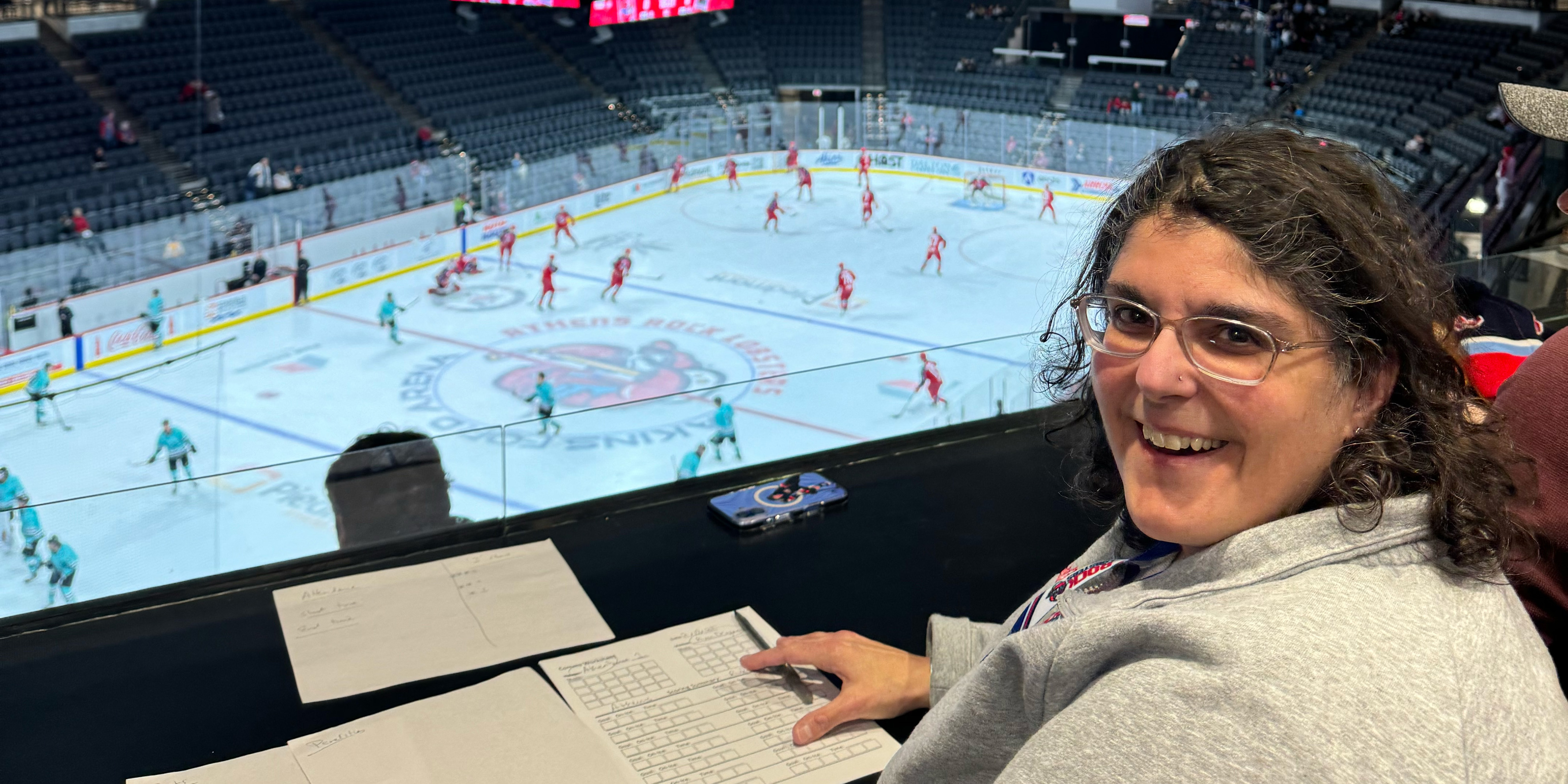 Woman watching a hockey game