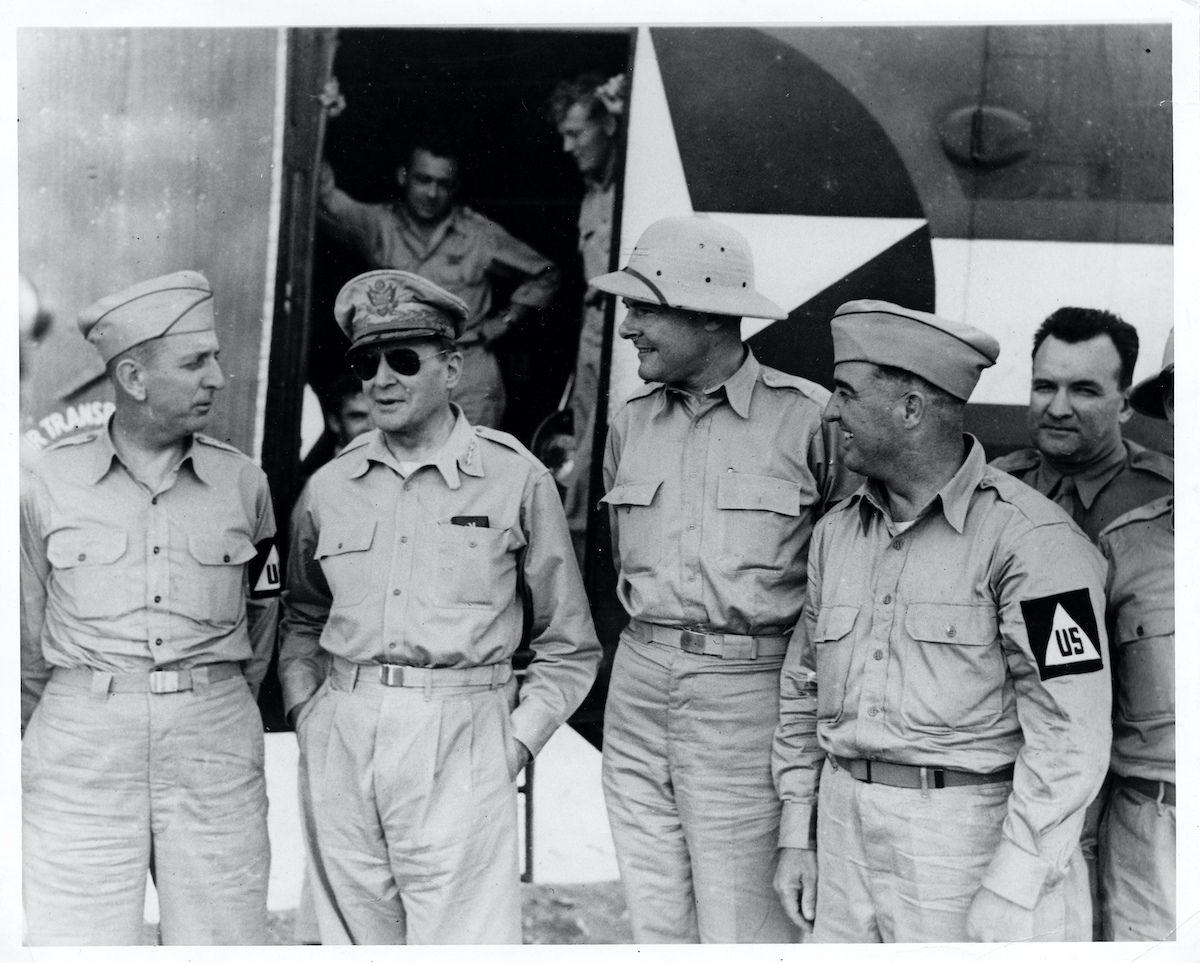 Russell with General Douglas MacArthur, Senator Henry Cabot Lodge, and Senator A.B. “Happy” Chandler during a 1943 inspection tour of military bases abroad. 