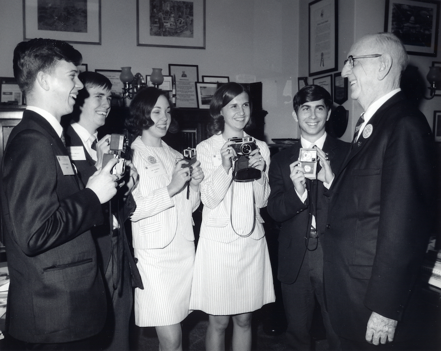 Russell with a group of 4-H club members in the 1960s.