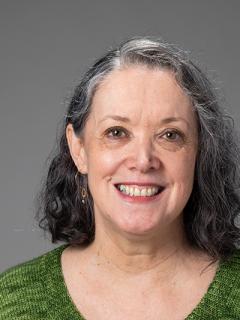 Woman smiling with green shirt