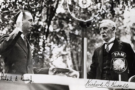 Richard B. Russell Sr. swears in his son, Richard B. Russell Jr., as governor in June 1931.