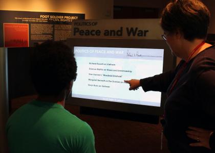 Student viewing Willson Media and Oral History Gallery